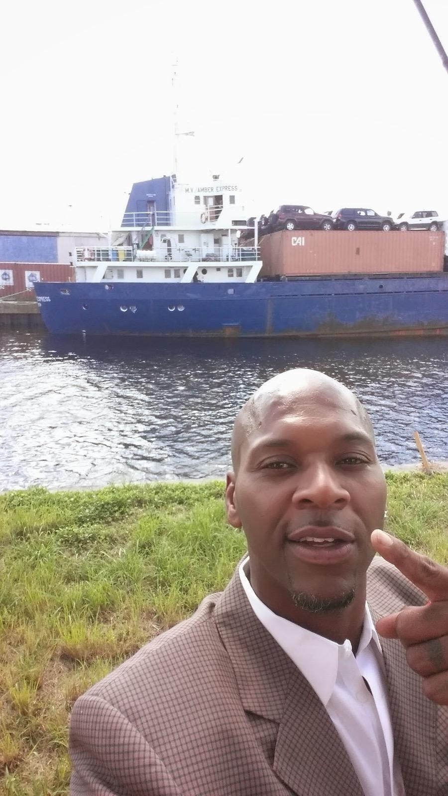 Samuel C. Mack alongside the chartered MV Amber Express during early commercial cargo operations on the Miami River